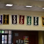 Greek organization banners are displayed in the lobby of the Stony Brook student union. (Nina Lin / The Statesman)